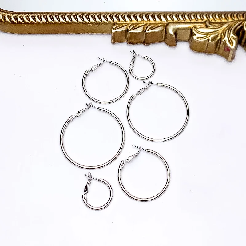 Hoop earrings with gold accents for a warm, elegant statement piece-Set Of Three | Hoop Earrings in Silver Tone