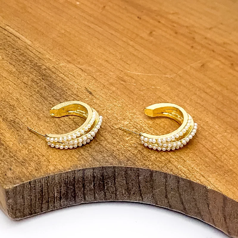 Hoop earrings with a matte black finish for a sleek, edgy vibe-Small Gold Tone Hoop Earrings Outlined in Pearls