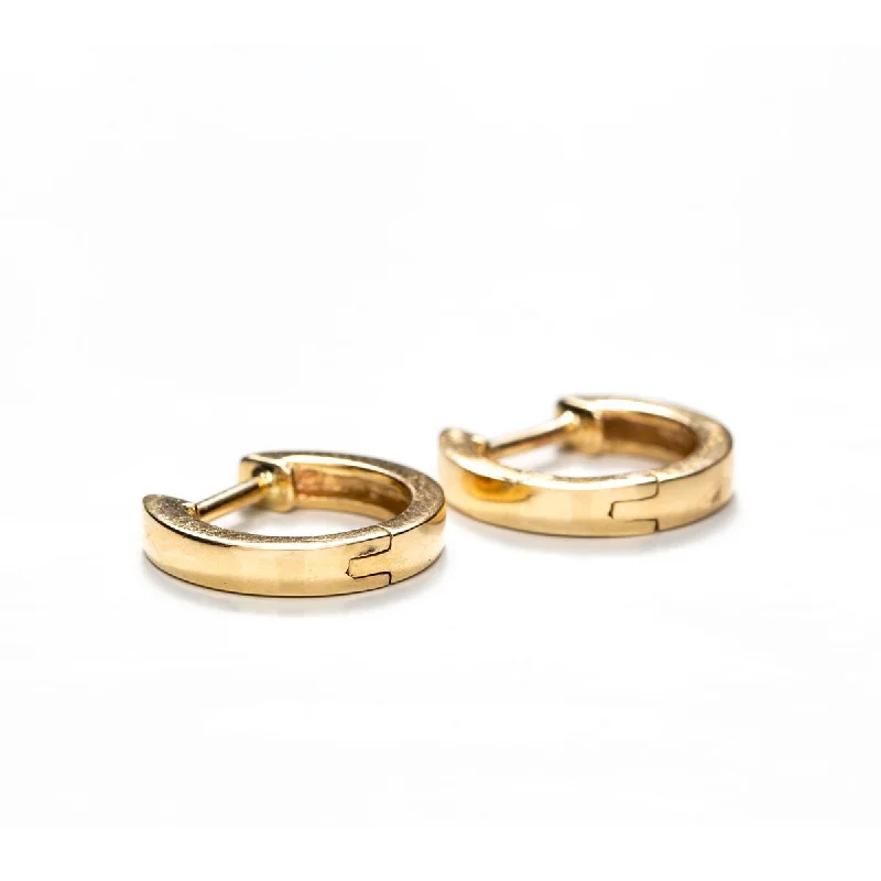 Best hoop earrings with asymmetrical designs for a fashion-forward, avant-garde look-Solid Gold Medium Huggies