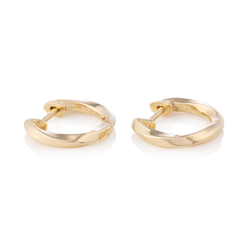 Best hoop earrings with gold for a luxurious and timeless look-Solid Gold Twist Huggies