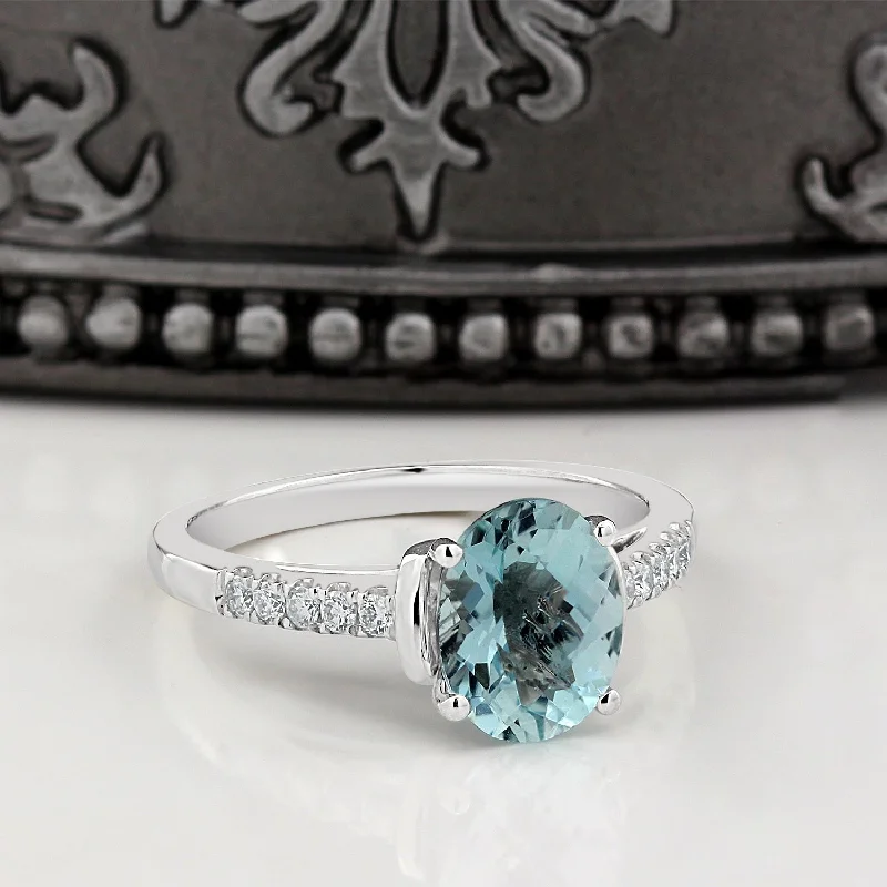 Rings with delicate filigree sapphire settings -Auriya 2ct Fancy Oval Swiss Blue Topaz and Diamond Engagement Ring 1/6ctw 14k Gold