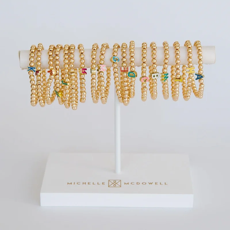 Best bangle bracelets with turquoise and silver for a Southwestern-inspired aesthetic-Gold Bead Initial Stretch Bracelet