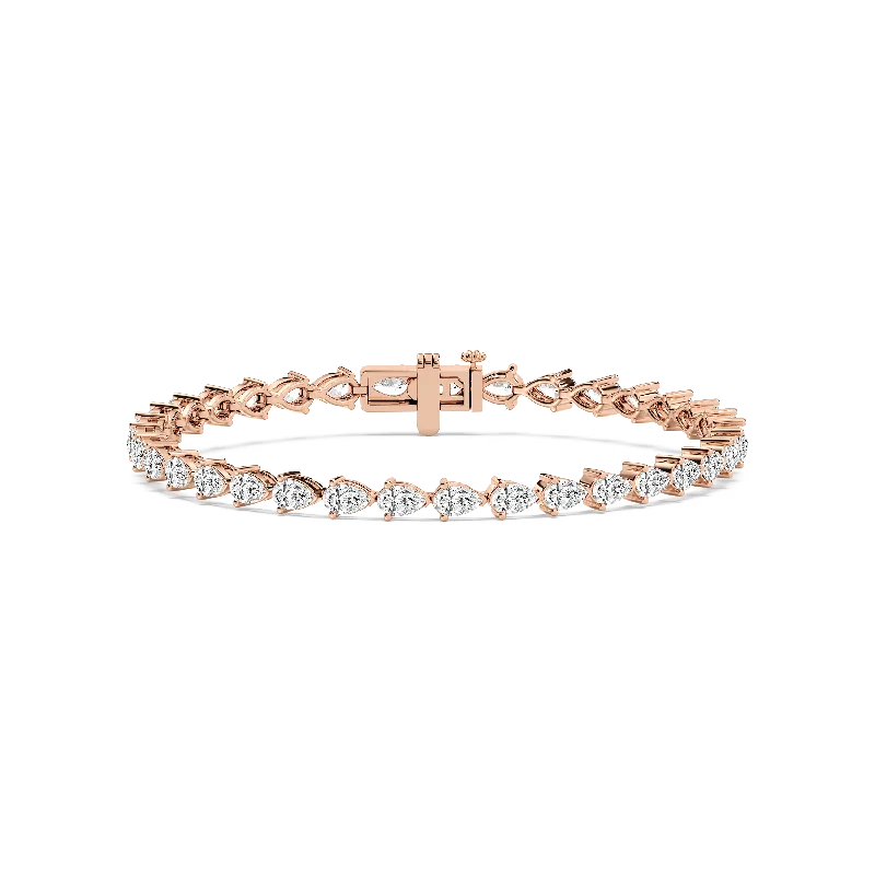 Chunky bangle bracelets with metallic finishes for a bold and statement-making look-Pear Tennis Bracelet