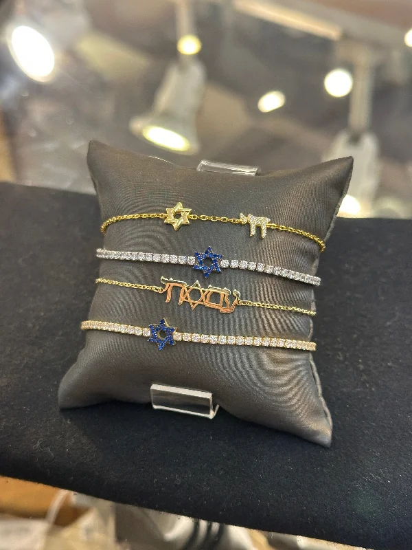 Stacked bangle bracelets with alternating textures for a dynamic, trendy look-Star of David& Chai Bracelet