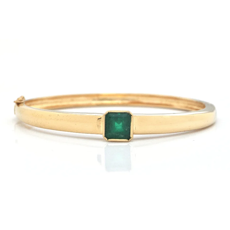 Bangle bracelets with colorful gemstone accents for a fun and vibrant pop of color-3.05ct Emerald 15K Yellow Gold Bangle Bracelet C.1970